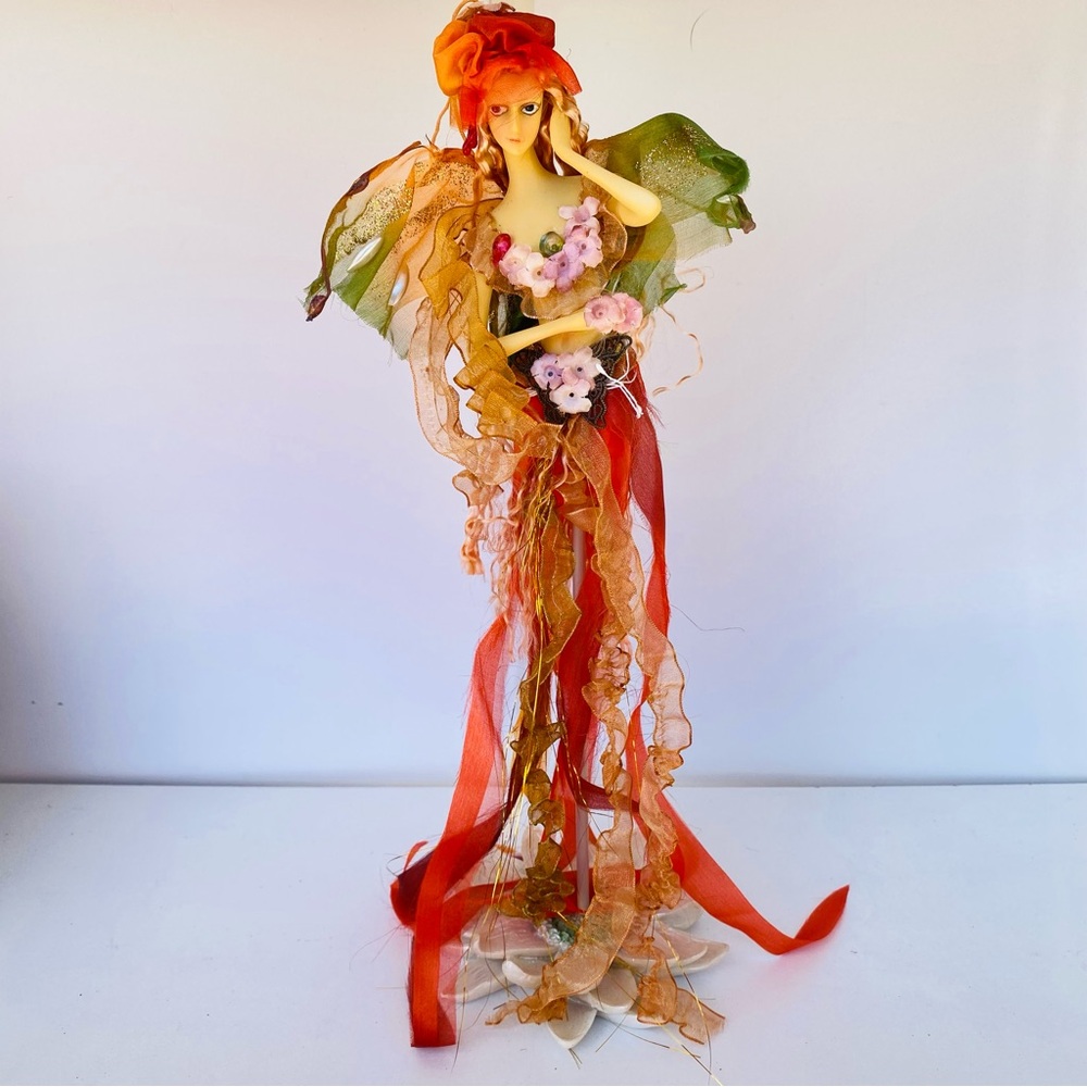 Elegant Figurine with Floral Accents